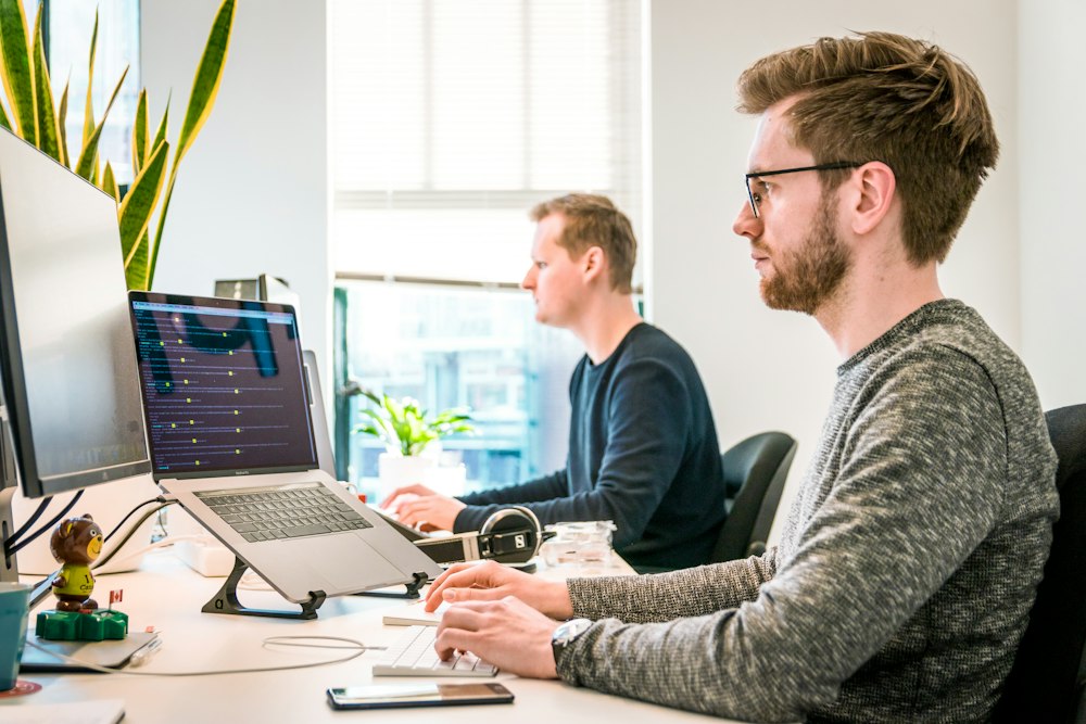 Software developers writing code at Erevu